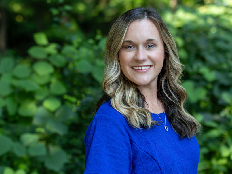 headshot of Emily Rush in an outdoor setting